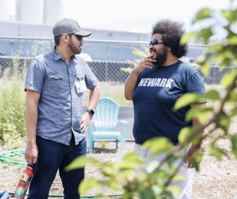 Two people in conversation outdoors